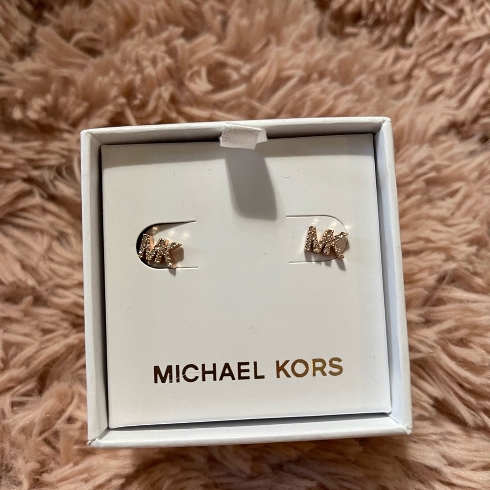 Brand new gold tone and diamond accent Michael Kors earrings.